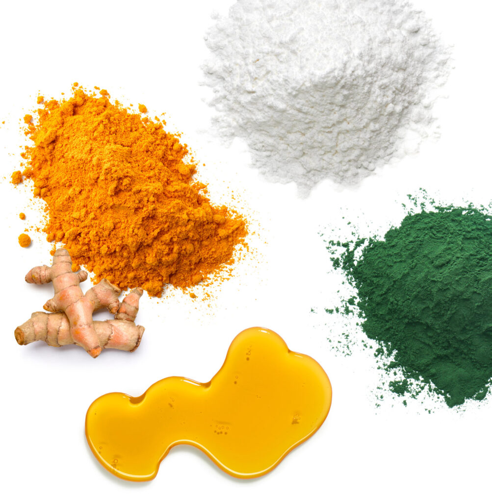top view of natural turmeric, oil, and powders